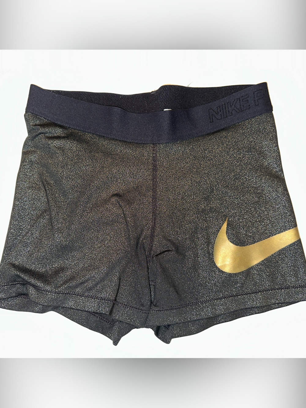 Nike Women’s Black Shorts with Gold Swoosh